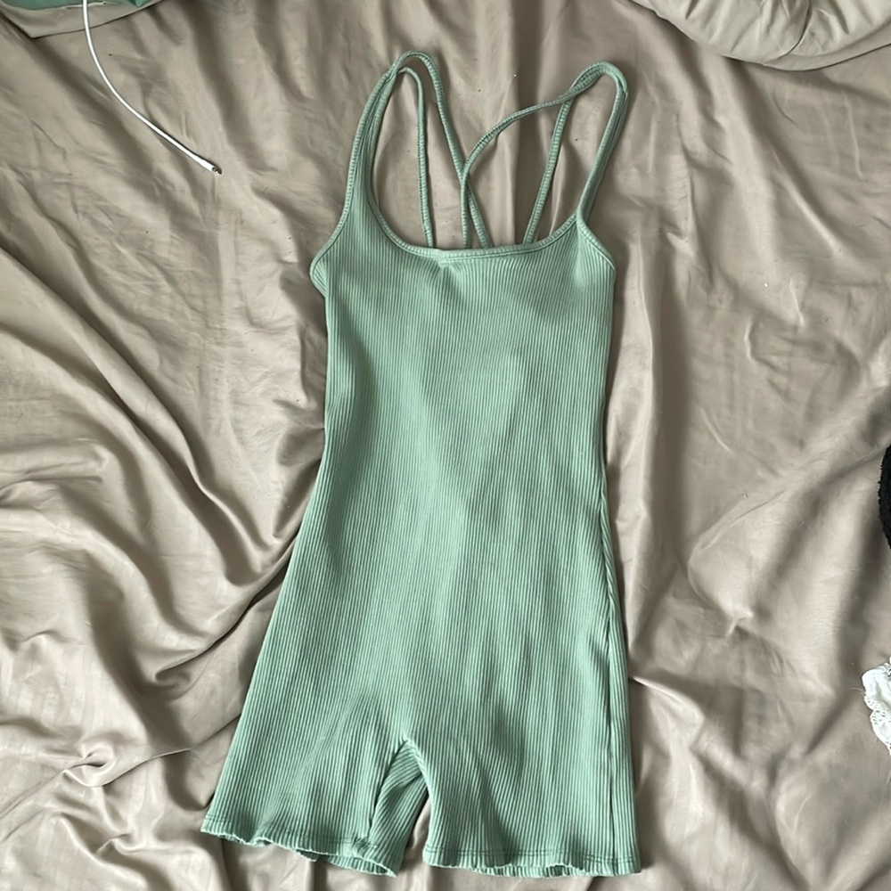 A green romper from Fashion Nova in a size small.